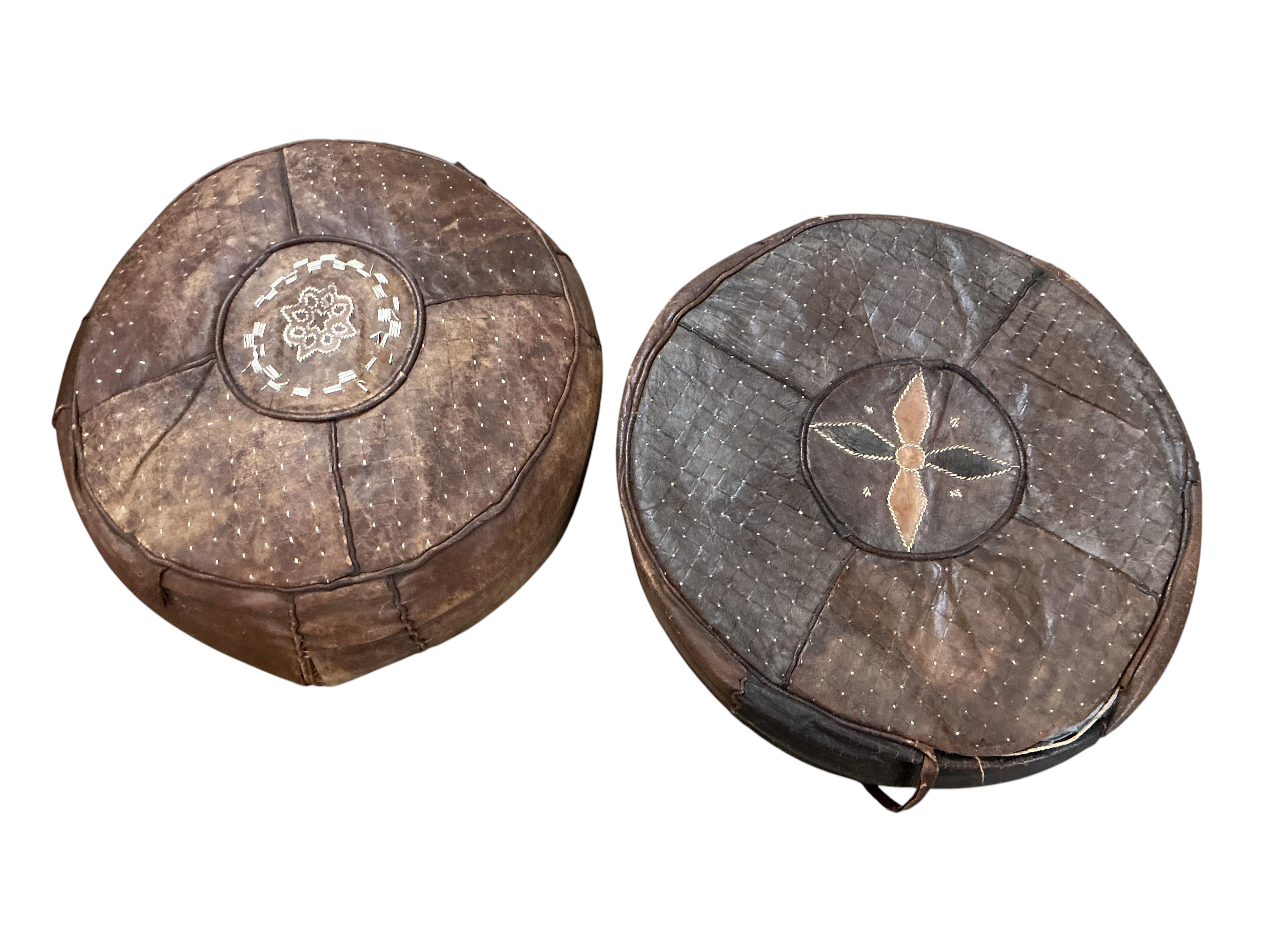 Five vintage Egyptian leather pouffe / footstools, largest diameter 60cm